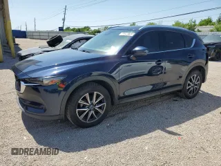 2018 Mazda CX-5 Grand Touring with VIN JM3KFBDM8J0344328, listed as a Copart auction lot 57665175 with 131,175 mi miles and Salvage title. Bid and sale history available at DreamBid. Image 1.