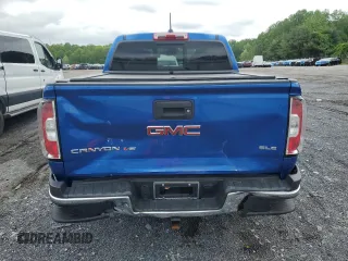 2019 GMC Canyon 4WD SLE z VIN 1GTG6CEN1K1206640, wystawiony jako Copart lot #55339285 z przebiegiem 52 166 mil mil oraz Szkody całkowita. Historia ofert i sprzedaży dostępna na DreamBid. Obrazek 6.