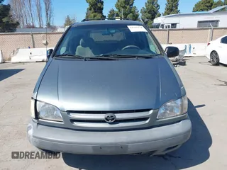1999 Toyota Sienna LE with VIN 4T3ZF13C1XU097653, listed as a IAAI auction lot 41765274 with 236,625 mi miles. Bid and sale history available at carsss.com. Image 6.