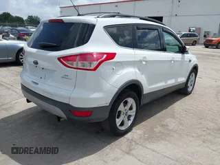 2013 Ford Escape SE with VIN 1FMCU0GX5DUA85464, listed as a IAAI auction lot 42452112 with 158,081 mi miles and . Bid and sale history available at DreamBid. Image 4.
