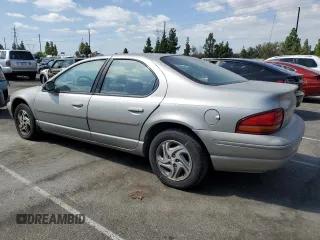 1997 Dodge Stratus z VIN 1B3EJ56H0VN679440, wystawiony jako Copart lot #71977454 z przebiegiem 83 367 mil mil oraz Tytuł czysty. Historia ofert i sprzedaży dostępna na DreamBid. Obrazek 2.