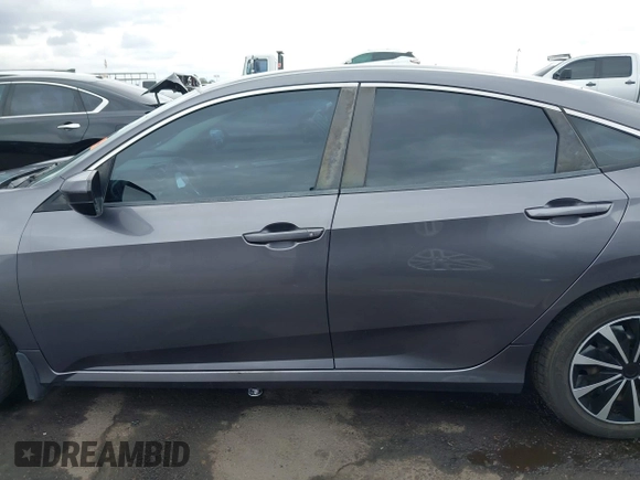 2017 Honda Civic LX with VIN 19XFC2F50HE055888, listed as a IAAI auction lot 42202494 with 147,354 mi miles and . Bid and sale history available at DreamBid. Image 14.