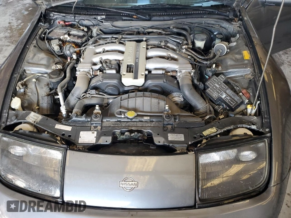1992 Nissan 300ZX z VIN JN1RZ26H3NX521303, wystawiony jako Copart lot #44807265 z przebiegiem 135 626 mil mil oraz Czysty tytuł • Clean title. Historia ofert i sprzedaży dostępna na DreamBid. Obrazek 11.