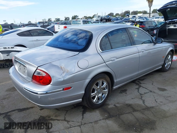 2003 Jaguar S-Type with VIN SAJEA01T83FM48713, listed as a IAAI auction lot 41402152 with 142,875 mi miles and . Bid and sale history available at DreamBid. Image 4.