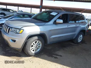 2018 Jeep Grand Cherokee Laredo E with VIN 1C4RJEAG3JC399869, listed as a IAAI auction lot 42305627 with 64,004 mi miles and . Bid and sale history available at DreamBid. Image 2.