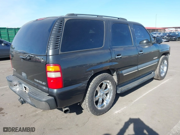 2003 Chevrolet Tahoe LS with VIN 1GNEC13V03R112315, listed as a IAAI auction lot 41424247 with 256,017 mi miles. Bid and sale history available at carsss.com. Image 4.