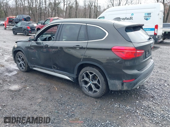 2018 BMW X1 xDrive28i with VIN WBXHT3C34J5K31430, listed as a IAAI auction lot 41954792 with 125,447 mi miles. Bid and sale history available at carsss.com. Image 3.