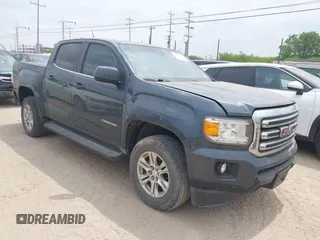 2019 GMC Canyon 4WD SLE z VIN 1GTG6CENXK1261278, wystawiony jako IAAI lot #42064295 z przebiegiem 51 786 mil mil oraz . Historia ofert i sprzedaży dostępna na DreamBid. Obrazek 1.