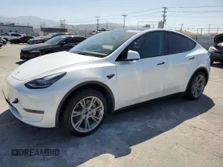 2023 Tesla Model Y Long Range z VIN 7SAYGDEE1PA097537, wystawiony jako Copart lot #57153645 z przebiegiem 21 865 mil mil oraz Szkoda całkowita • Salvage title. Historia ofert i sprzedaży dostępna na DreamBid. Obrazek 1.