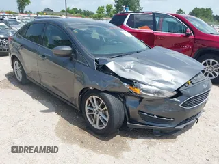 2018 Ford Focus SE z VIN 1FADP3FE9JL214783, wystawiony jako IAAI lot #42625660 z przebiegiem 78 771 mil mil oraz . Historia ofert i sprzedaży dostępna na DreamBid. Obrazek 1.