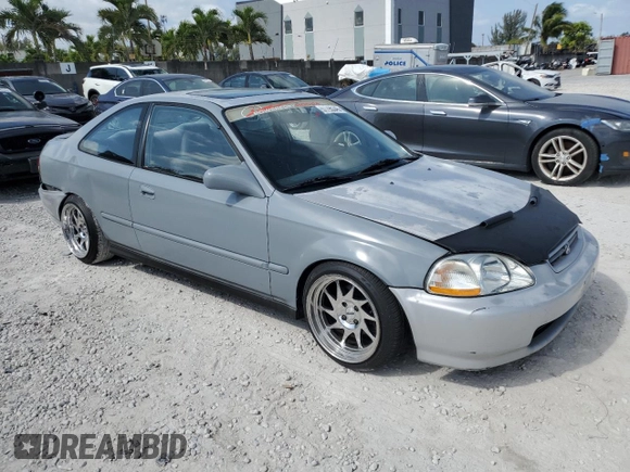 1997 Honda Civic EX z VIN 1HGEJ8143VL043998, wystawiony jako Copart lot #51795345 z przebiegiem 129 631 mil mil oraz Nie do naprawy • Non repairable. Historia ofert i sprzedaży dostępna na DreamBid. Obrazek 4.