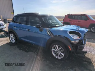 2012 MINI Countryman S with VIN WMWZC3C57CWL80976, listed as a Copart auction lot 50023105 with 74,504 mi miles and Salvage Title. Bid and sale history available at DreamBid. Image 4.