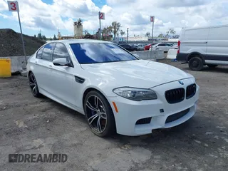 2013 BMW M5 with VIN WBSFV9C56DC772961, listed as a IAAI auction lot 41765457 with 104,568 mi miles. Bid and sale history available at carsss.com. Image 1.