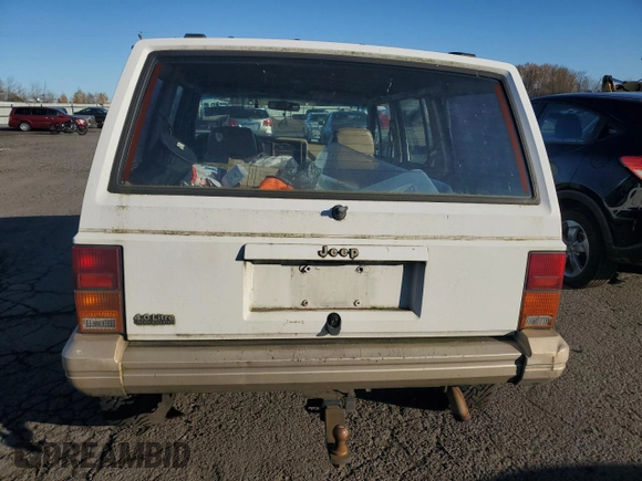 1993 Jeep Cherokee Country with VIN 1J4FJ78S0PL565292, listed as a Copart auction lot 83214974 with 233,925 mi miles and Clean Title. Bid and sale history available at carsss.com. Image 6.