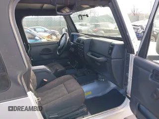 2003 Jeep Wrangler X with VIN 1J4FA39S33P363153, listed as a IAAI auction lot 41584805 with 160,676 mi miles. Bid and sale history available at carsss.com. Image 5.