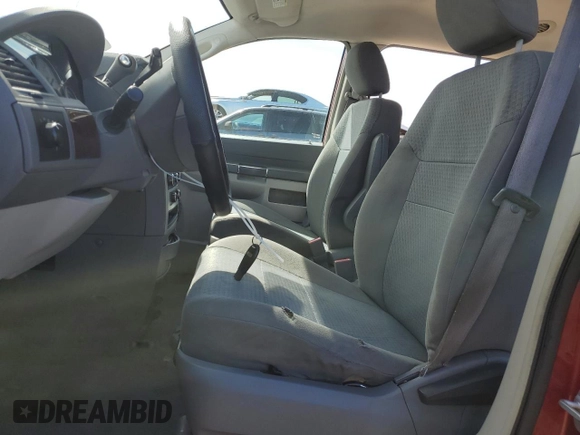 2010 Chrysler Town & Country LX with VIN 2A4RR4DE3AR192493, listed as a Copart auction lot 52725285 with 171,468 mi miles and Salvage Title. Bid and sale history available at DreamBid. Image 7.