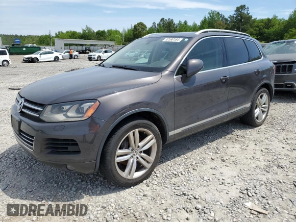 2013 Volkswagen Touareg Lux with VIN WVGEF9BP8DD002947, listed as a Copart auction lot 52590164 with 144,831 mi miles and Salvage Title. Bid and sale history available at DreamBid. Image 1.