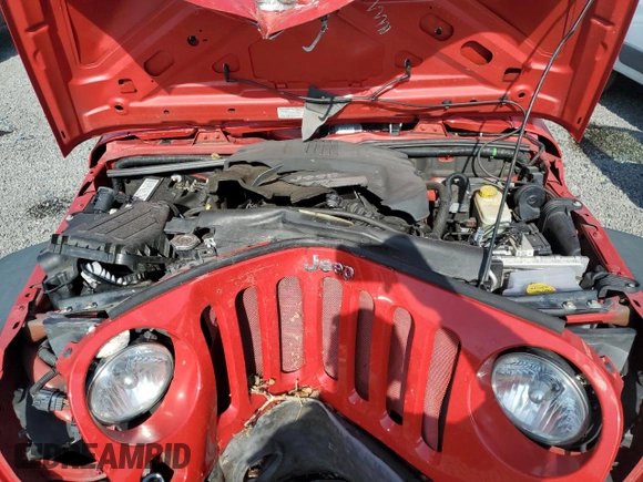 2013 Jeep Wrangler Unlimited Sport z VIN 1C4BJWDG1DL694556, wystawiony jako Copart lot #58730525 z przebiegiem Nie podano mil oraz Szkoda całkowita • Salvage title. Historia ofert i sprzedaży dostępna na DreamBid. Obrazek 11.