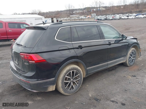 2021 Volkswagen Tiguan SE with VIN 3VV2B7AX0MM049291, listed as a IAAI auction lot 41910106 with 68,468 mi miles. Bid and sale history available at carsss.com. Image 4.