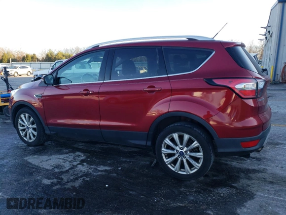 2017 Ford Escape Titanium with VIN 1FMCU0JD7HUD41107, listed as a Copart auction lot 85657084 with 197,982 mi miles and Salvage Title. Bid and sale history available at DreamBid. Image 2.