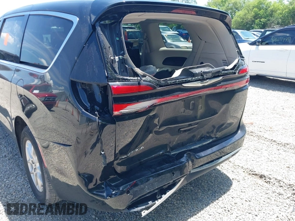 2023 Chrysler Pacifica Touring L with VIN 2C4RC1BG1PR606504, listed as a IAAI auction lot 42647652 with 41,598 mi miles and . Bid and sale history available at DreamBid. Image 18.