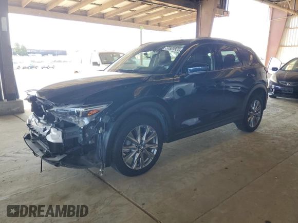 2019 Mazda CX-5 Grand Touring with VIN JM3KFADM3K1539890, listed as a Copart auction lot 57809835 with 56,079 mi miles and Salvage title. Bid and sale history available at DreamBid. Image 1.