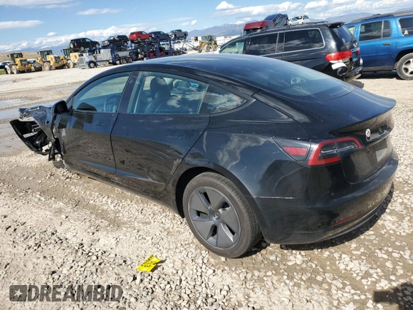 2023 Tesla Model 3 with VIN 5YJ3E1EAXPF708001, listed as a Copart auction lot 57252735 with 71,579 mi miles and Salvage title. Bid and sale history available at DreamBid. Image 2.