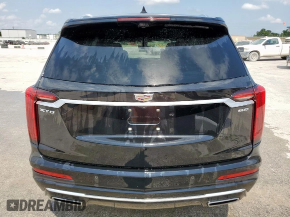2020 Cadillac XT6 FWD Premium Luxury с VIN 1GYKPCRSXLZ104502, выставлен на аукционе Copart как лот 58211275 с пробегом 97 053 миль миль и Списание • Salvage title. История ставок и продаж доступна на DreamBid. Изображение 6.