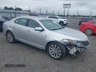 2013 Lincoln MKS with VIN 1LNHL9DK3DG604712, listed as a IAAI auction lot 42351237 with 144,927 mi miles and . Bid and sale history available at DreamBid. Image 1.