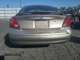 2003 Ford Taurus SEL Deluxe with VIN 1FAFP56S23G221922, listed as a Copart auction lot 79673294 with 142,911 mi miles and Salvage Title. Bid and sale history available at DreamBid. Image 6.