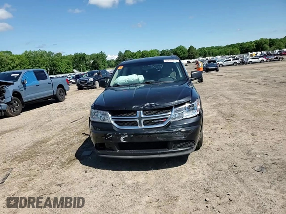 2013 Dodge Journey SE with VIN 3C4PDCAB5DT729415, listed as a Copart auction lot 55851915 with 128,782 mi miles and Salvage title. Bid and sale history available at DreamBid. Image 14.
