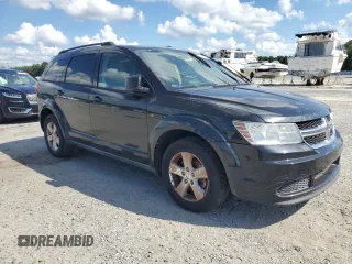 2013 Dodge Journey SE with VIN 3C4PDCAB4DT537984, listed as a Copart auction lot 62683165 with 228,062 mi miles and Clean title. Bid and sale history available at DreamBid. Image 4.