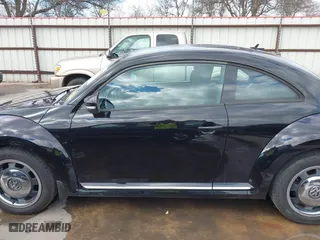 2012 Volkswagen Beetle 2.5L w/Sun/Sound/Nav PZEV with VIN 3VWHP7AT0CM623536, listed as a IAAI auction lot 41351333 with 106,600 mi miles. Bid and sale history available at carsss.com. Image 14.