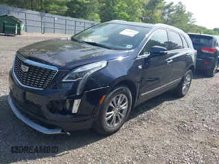 2021 Cadillac XT5 AWD Premium Luxury z VIN 1GYKNDRS8MZ217572, wystawiony jako IAAI lot #42190571 z przebiegiem 25 100 mil mil oraz . Historia ofert i sprzedaży dostępna na DreamBid. Obrazek 2.