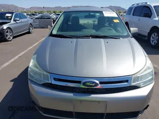 2008 Ford Focus SE with VIN 1FAHP35N68W154490, listed as a IAAI auction lot 42128643 with 141,316 mi miles. Bid and sale history available at carsss.com. Image 12.