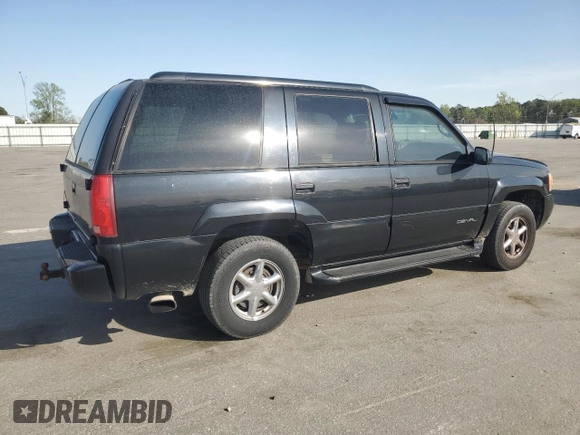 1999 GMC Denali with VIN 1GKEK13R1XR912632, listed as a Copart auction lot 51223085 with 223,201 mi miles and Salvage Title. Bid and sale history available at carsss.com. Image 3.