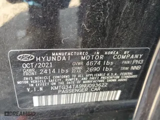 2022 Genesis G70 2.0T with VIN KMTG34TA9NU093622, listed as a Copart auction lot 77797024 with 51,637 mi miles and Salvage Title. Bid and sale history available at carsss.com. Image 12.