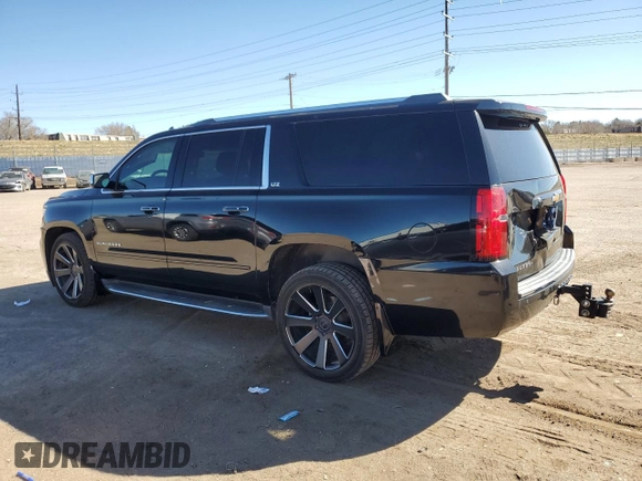 2015 Chevrolet Suburban LTZ with VIN 1GNSKKKC2FR634654, listed as a Copart auction lot 50337415 with 150,255 mi miles and Salvage Title. Bid and sale history available at DreamBid. Image 2.