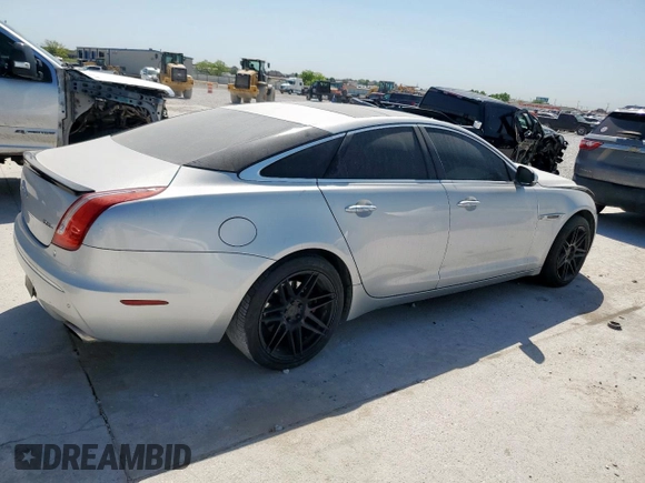 2012 Jaguar XJ with VIN SAJWA1CB0CLV23002, listed as a Copart auction lot 52804915 with 149,331 mi miles and Salvage title. Bid and sale history available at DreamBid. Image 3.