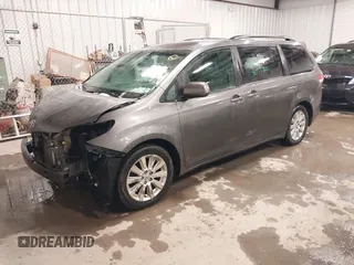 2011 Toyota Sienna LE with VIN 5TDJK3DC2BS013045, listed as a IAAI auction lot 41127037 with 239,401 mi miles. Bid and sale history available at carsss.com. Image 2.