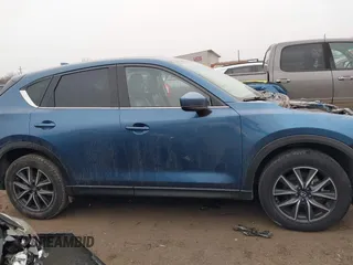 2017 Mazda CX-5 Grand Touring with VIN JM3KFADL9H0187338, listed as a IAAI auction lot 41382034 with 141,972 mi miles and . Bid and sale history available at carsss.com. Image 14.