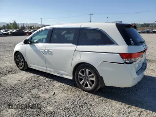 2016 Honda Odyssey Touring Elite with VIN 5FNRL5H9XGB006981, listed as a Copart auction lot 63970385 with 165,164 mi miles and Salvage title. Bid and sale history available at DreamBid. Image 2.