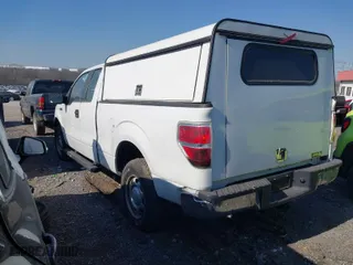 2010 Ford F-150 XL with VIN 1FTEX1E88AKE76184, listed as a IAAI auction lot 41715520 with 157,449 mi miles. Bid and sale history available at carsss.com. Image 3.