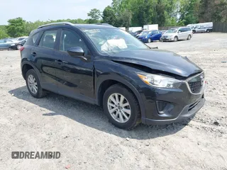 2014 Mazda CX-5 Sport with VIN JM3KE2BE3E0405976, listed as a IAAI auction lot 42161069 with 66,301 mi miles and . Bid and sale history available at carsss.com. Image 1.