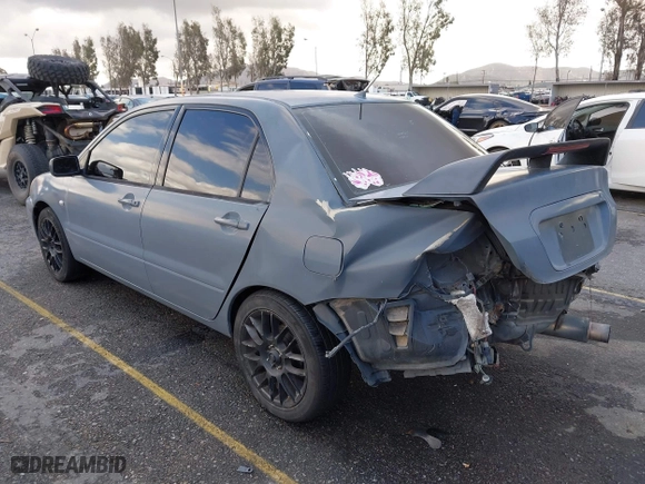 2004 Mitsubishi Lancer ES with VIN JA3AJ26E54U054570, listed as a IAAI auction lot 41592397 with 220,140 mi miles. Bid and sale history available at carsss.com. Image 3.