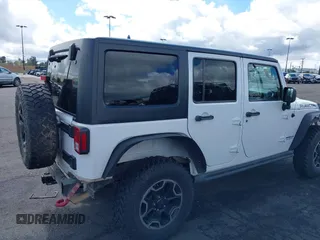 2016 Jeep Wrangler Unlimited Rubicon with VIN 1C4HJWFG7GL254143, listed as a IAAI auction lot 41781962 with 114,435 mi miles and . Bid and sale history available at DreamBid. Image 4.