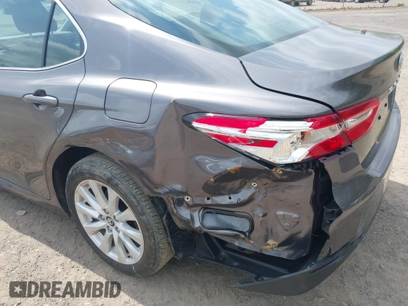 2019 Toyota Camry LE with VIN 4T1B11HK9KU229110, listed as a IAAI auction lot 42133332 with 17,541 mi miles and . Bid and sale history available at DreamBid. Image 18.