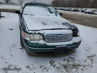 2000 Ford Crown Victoria with VIN 2FAFP73WXYX157746, listed as a Copart auction lot 82748804 with 56,820 mi miles and Salvage Title. Bid and sale history available at carsss.com. Image 5.