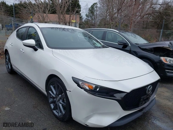 2019 Mazda Mazda3 Hatchback with VIN JM1BPAJM3K1135627, listed as a IAAI auction lot 41561810 with 30,558 mi miles. Bid and sale history available at carsss.com. Image 1.
