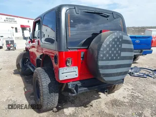 2002 Jeep Wrangler Sport with VIN 1J4FA49S42P771262, listed as a IAAI auction lot 41819403 with 132,871 mi miles. Bid and sale history available at carsss.com. Image 3.